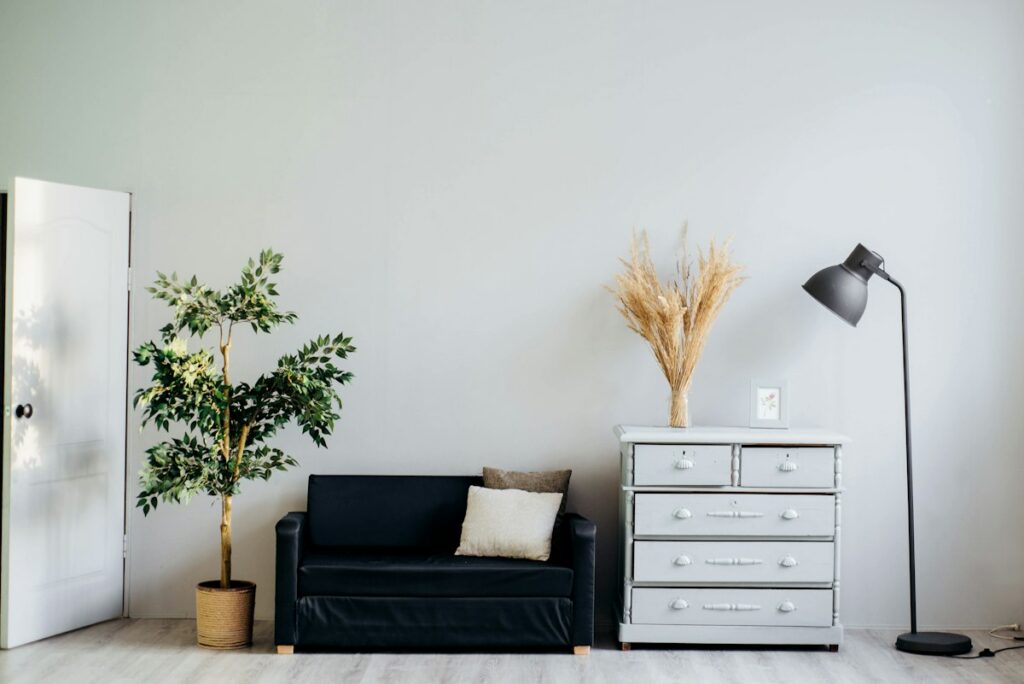 Warm minimalist living room with linen sofa and wooden coffee table