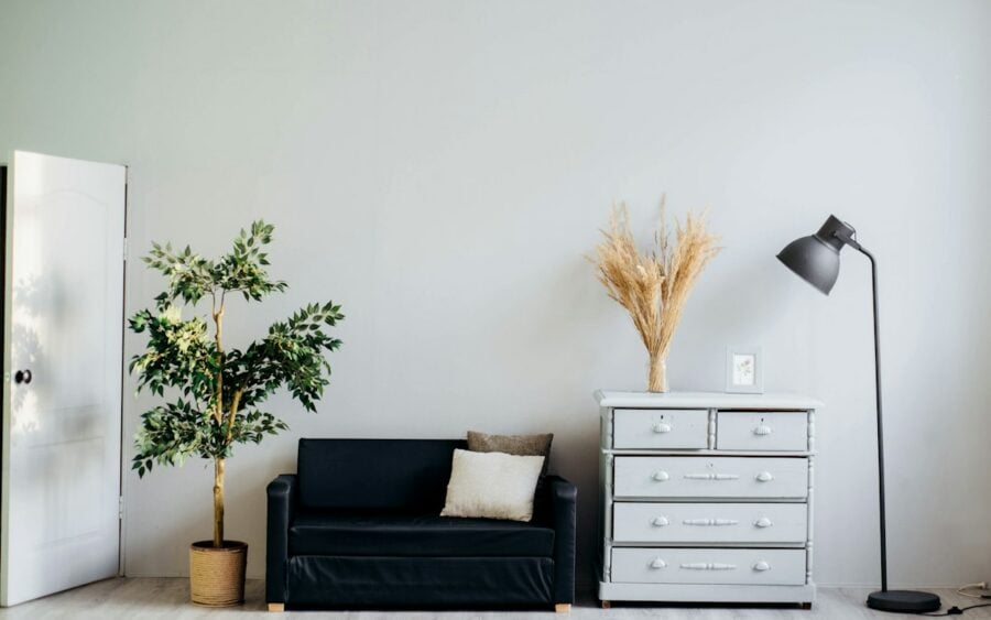 Warm minimalist living room with linen sofa and wooden coffee table