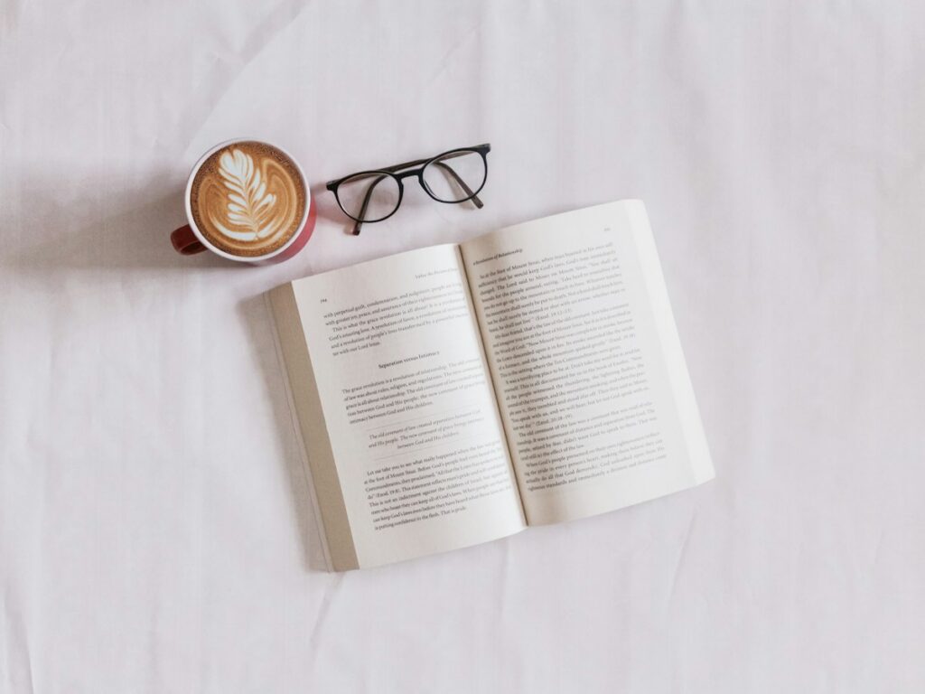 Minimalist electronic ink tablet and coffee cup on table