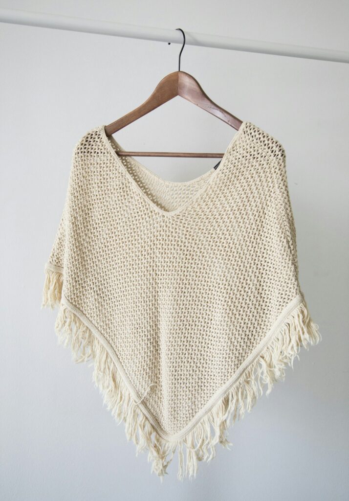 Layered neutral clothing ensemble featuring wool and soft knits