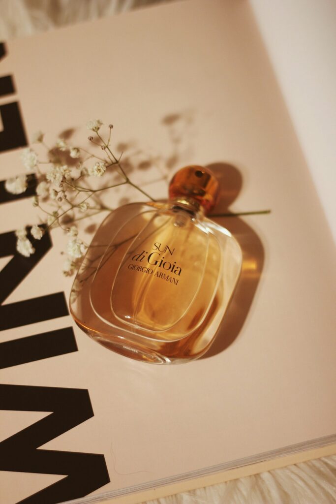 Artisanal perfume glass bottle with natural botanical amber hue