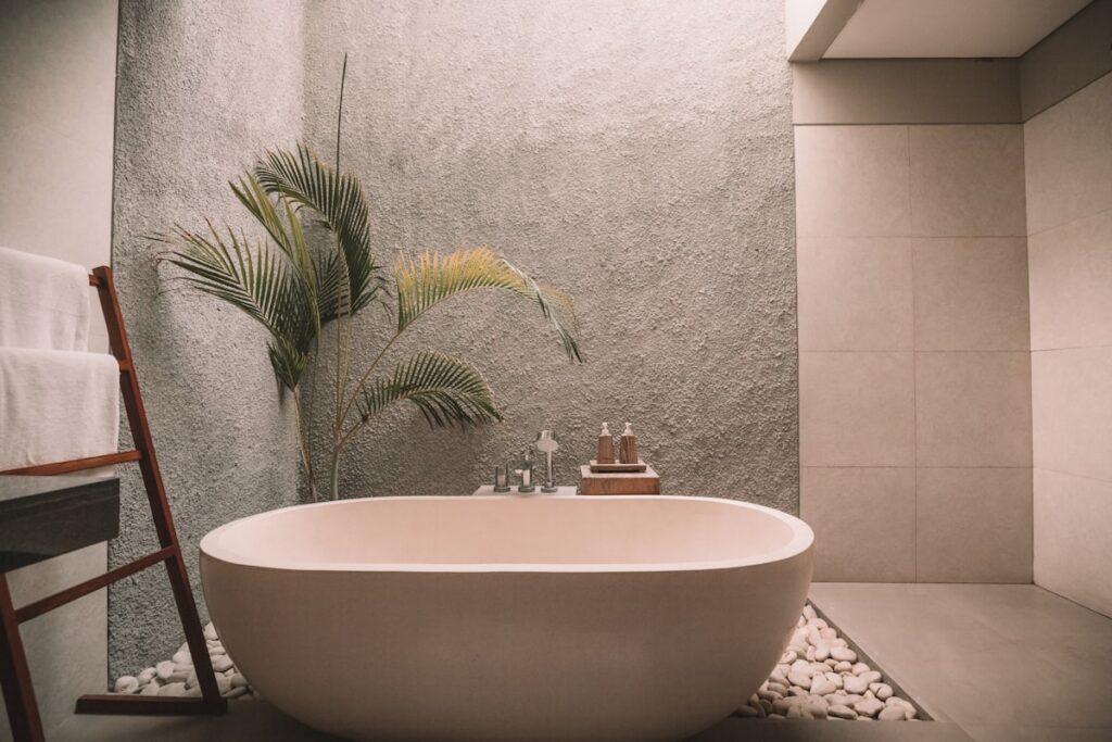 Spa bath setting with neutral towels and botanical soaps
