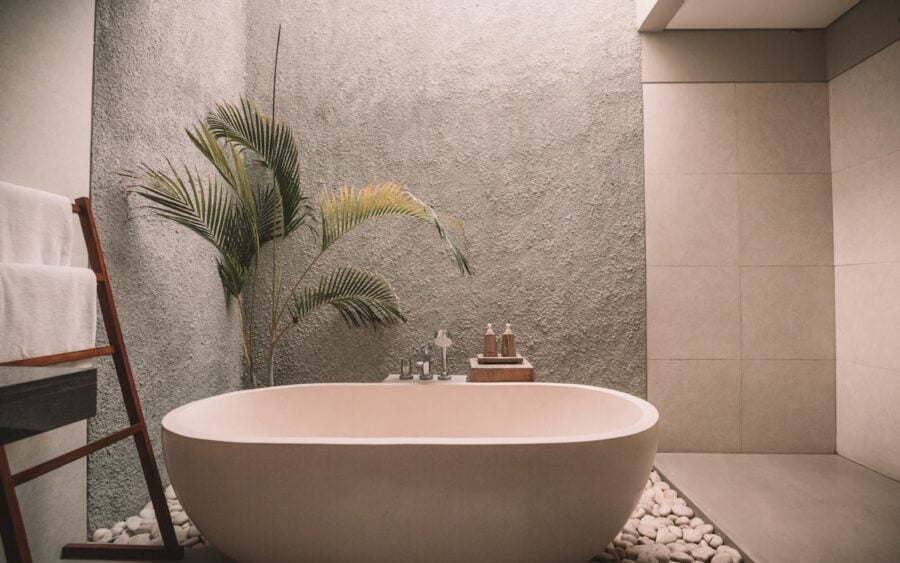Spa bath setting with neutral towels and botanical soaps