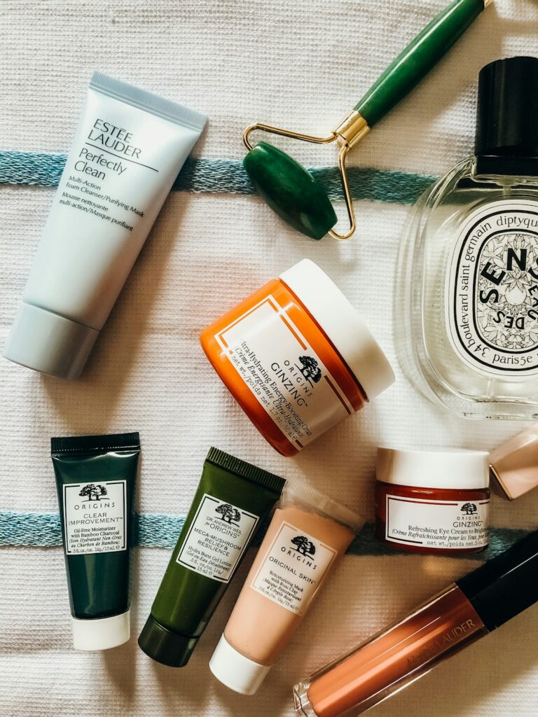 Clean botanical skincare glass bottles and ceramic dish