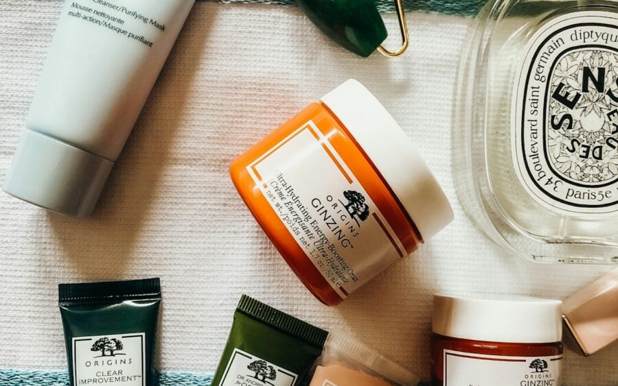 Clean botanical skincare glass bottles and ceramic dish